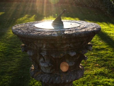Image of sundial in grassy area